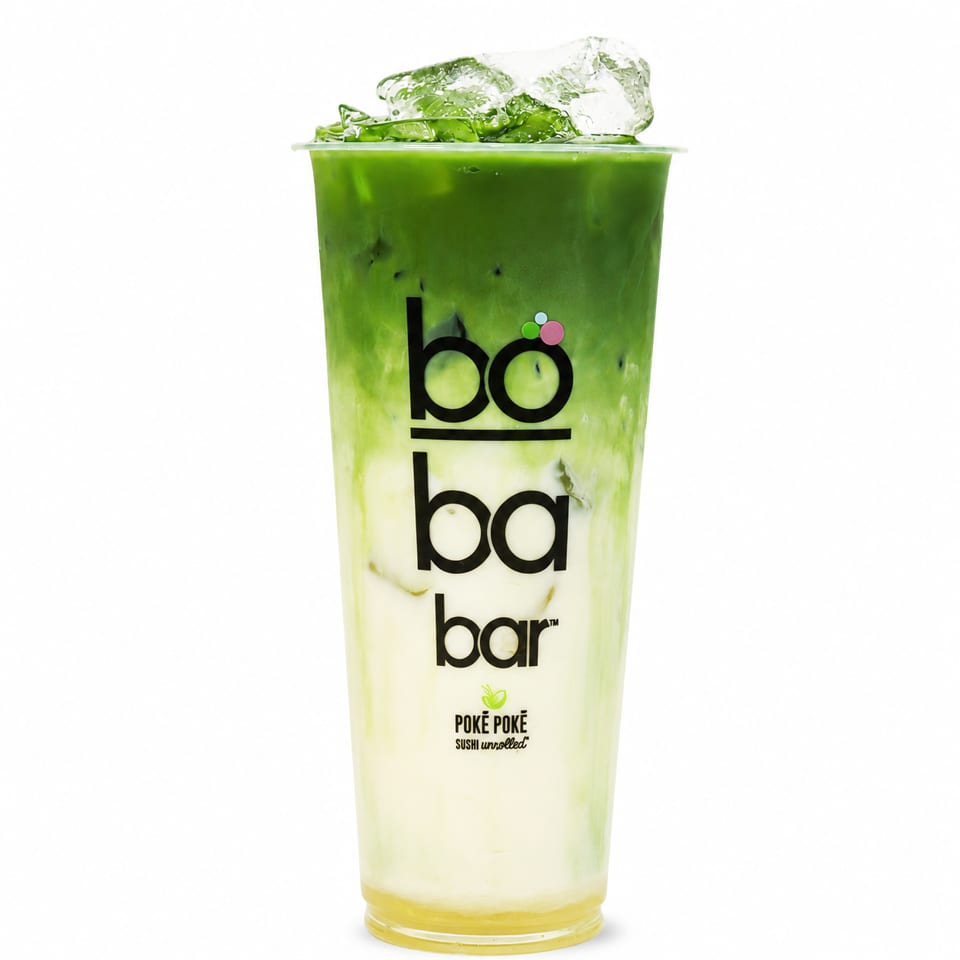 Iced matcha latte with a distinct green top layer and creamy white bottom layer in a Boba Bar cup.